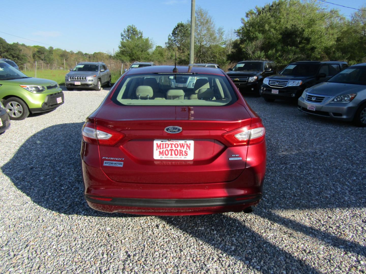 2015 Red Ford Fusion SE (3FA6P0HDXFR) with an 1.5L L4 DOHC 16V engine, Automatic transmission, located at 15016 S Hwy 231, Midland City, AL, 36350, (334) 983-3001, 31.306210, -85.495277 - Photo#6